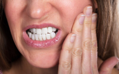 Overcoming The Common Denture Problems of Slippage, Sore Spots, and Speech Issues